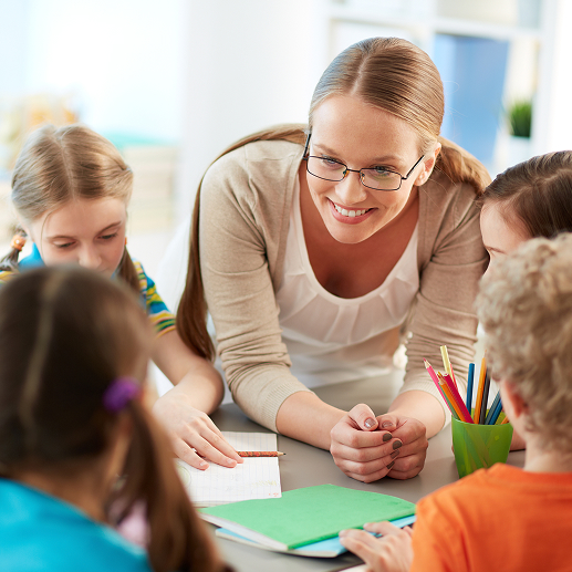 Happy-teacher-listening-her-students 1